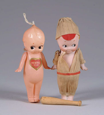 Appraisal: - GERMAN KEWPIE CELLULOID KEWPIE Taller Kewpie is dressed as