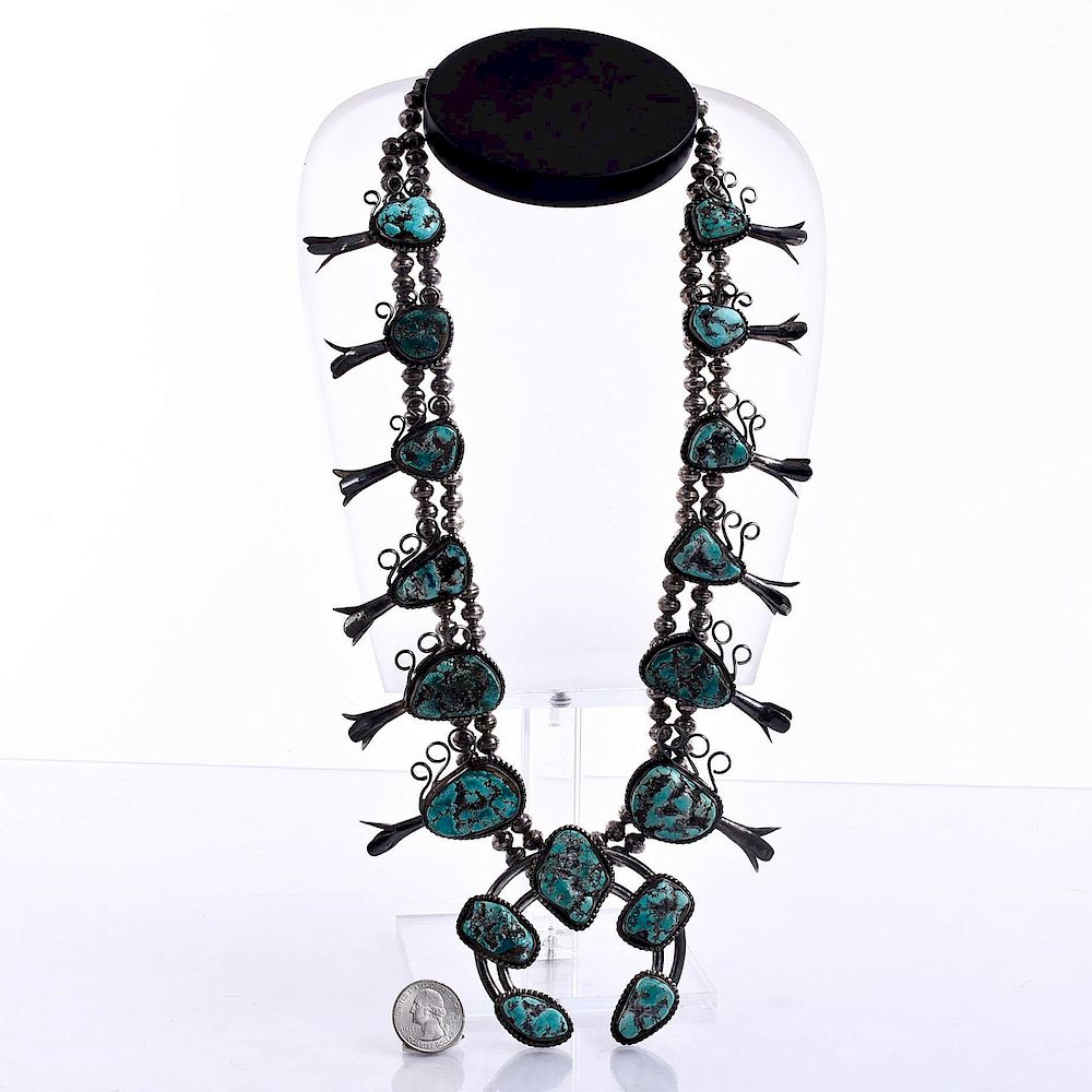 Appraisal: NATIVE AMERICAN TURQUOISE SQUASH BLOSSOM NECKLACE Turquoise stones silver bead