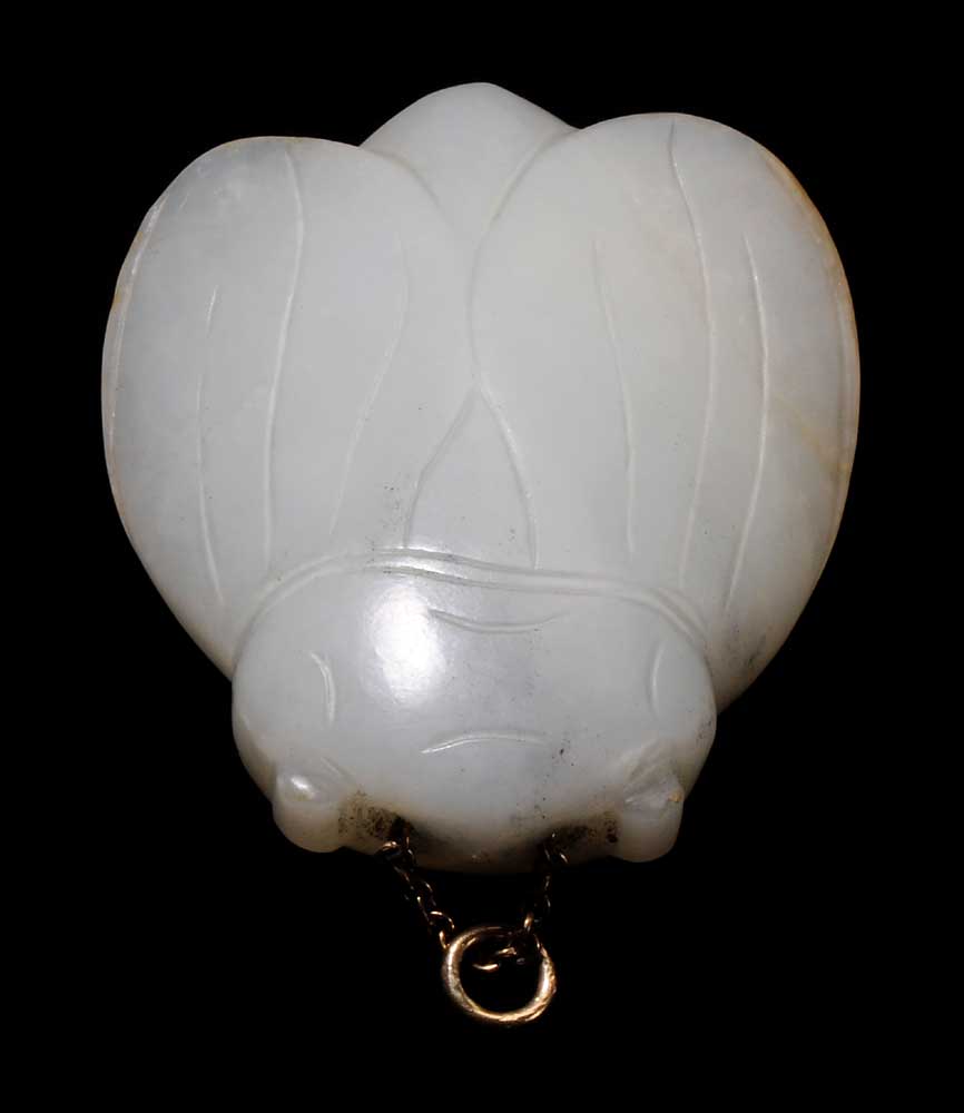 Appraisal: White Jade Cicada Toggle Chinese black and russet inclusions bull-nose