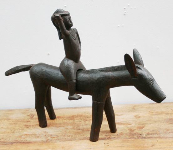 Appraisal: A carved wooden horse and rider the rider detachable tribal