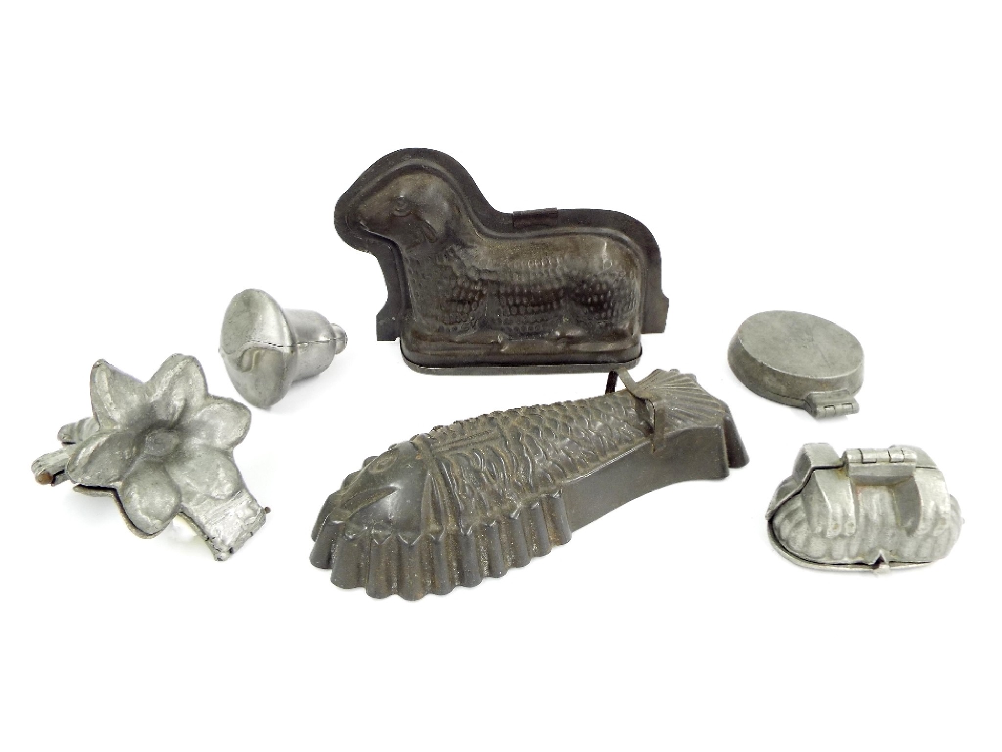 Appraisal: Four various cast pewter confectionery moulds along with two tin