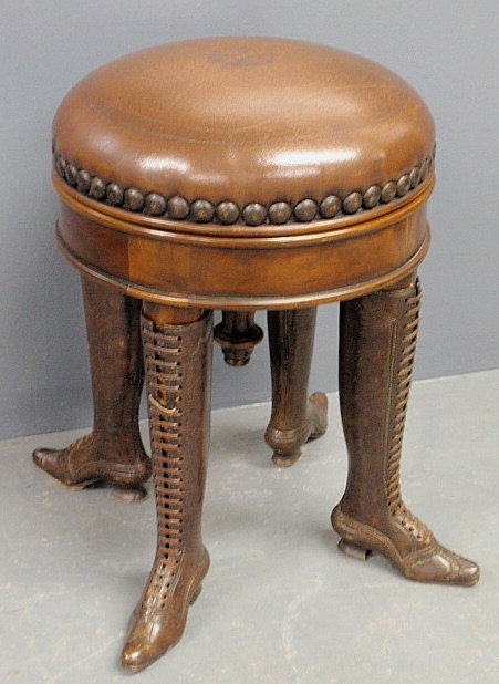 Appraisal: - Unusual th c style leather top mahogany piano stool