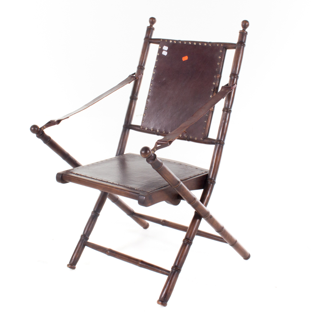 Appraisal: Campaign style folding chair and ottoman bamboo turned wood with