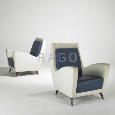 Appraisal: ITALIAN Pair of club chairs s Leather and stained wood