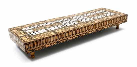 Appraisal: A Wood and Ivory Inlaid Cribbage Board having an end