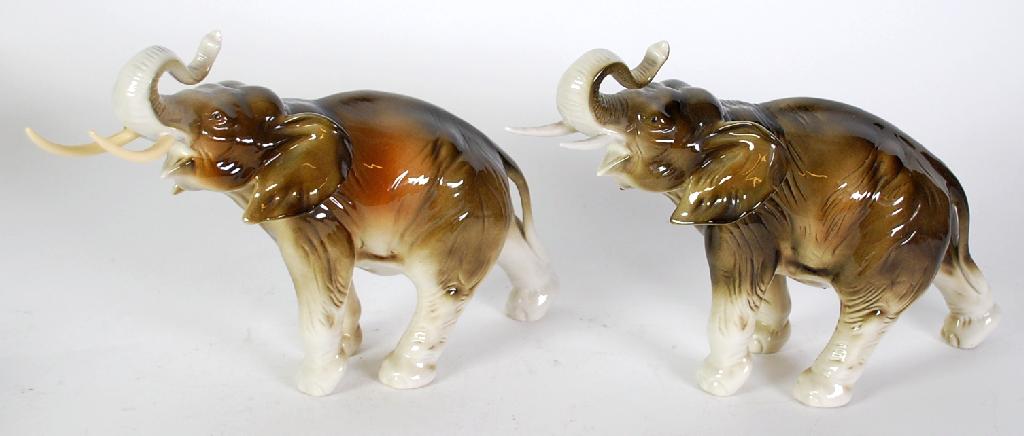 Appraisal: TWO IDENTICAL ROYAL DUX ELEPHANTS with naturalistically glazed bodies one