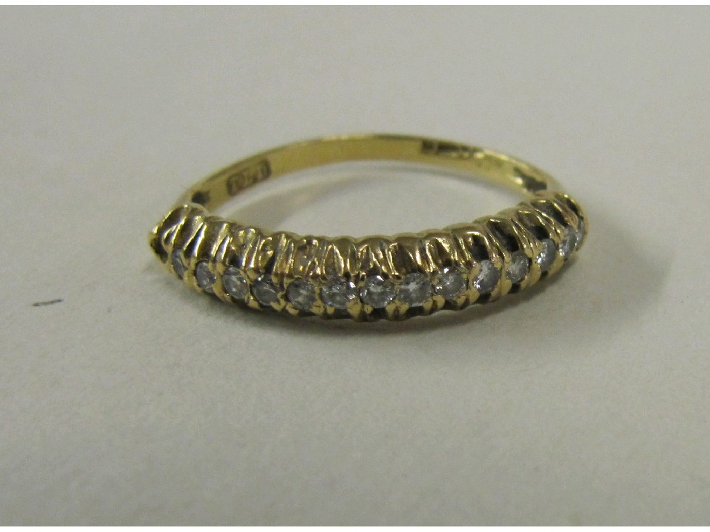 Appraisal: Eighteen carat gold diamond half hoop ring one stone missing