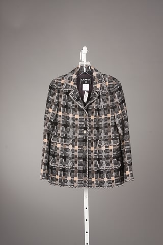 Appraisal: Chanel Black white tan wool jacket with signature pockets and