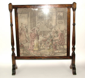 Appraisal: A mahogany fire-screen with turned supports and glazed tapestry panel