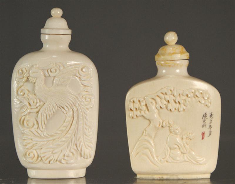 Appraisal: carved ivory snuff bottles w phoenix bird dragon the other