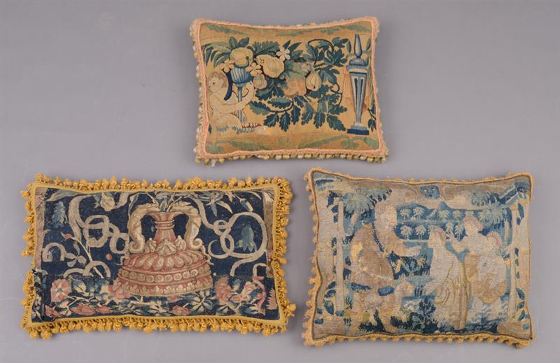 Appraisal: GROUP OF THREE FLEMISH TAPESTRY-MOUNTED PILLOWS Comprising one with five