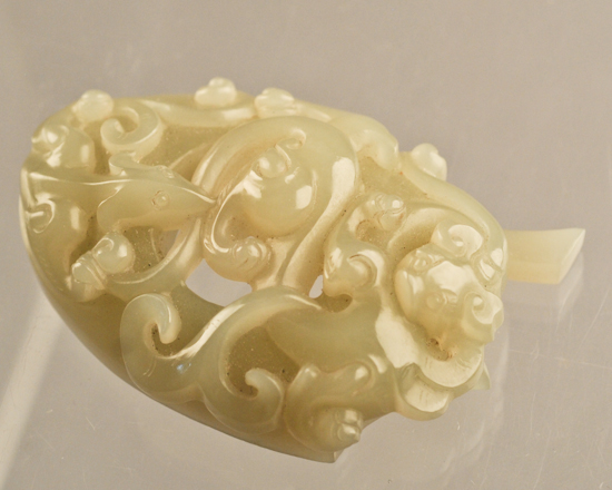 Appraisal: A Small Chinese Jade Carving pierced and relief carved with