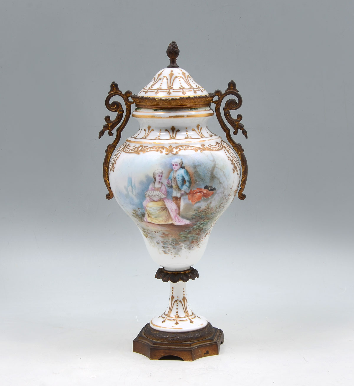 Appraisal: ORMOLU MOUNTED SEVRES URN Sevres lidded urn having a hand-painted