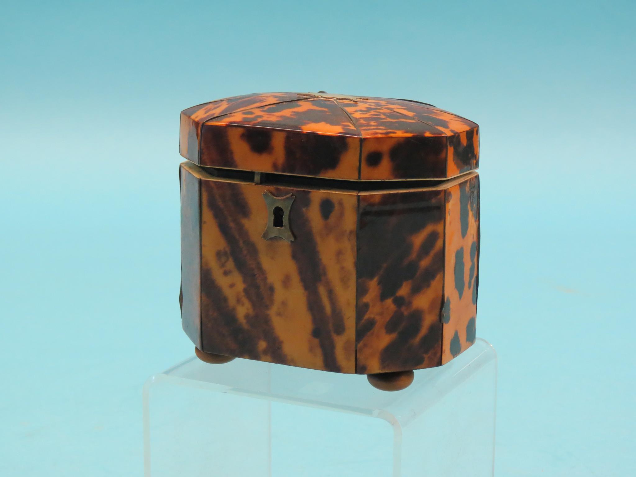 Appraisal: A small George III tortoiseshell tea caddy elongated octagonal shape