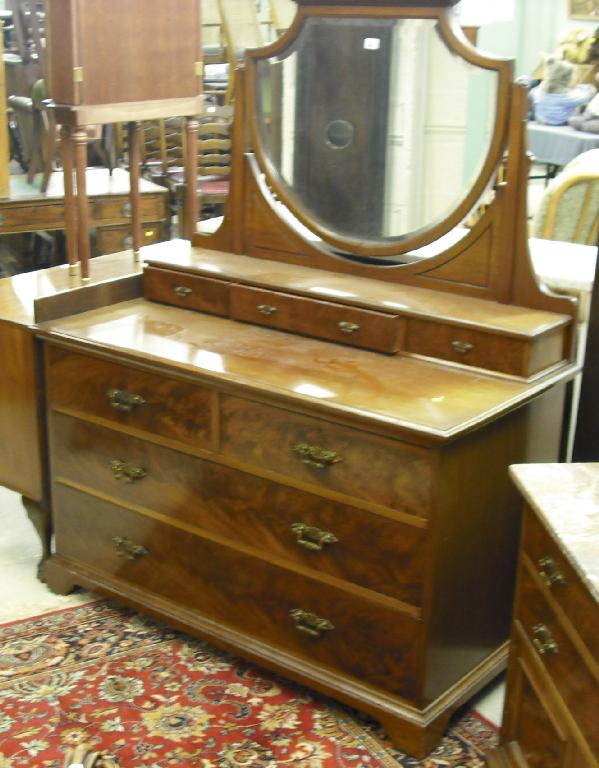 Appraisal: Edwardian mahogany dressing chest the shield bevelled mirror upon three