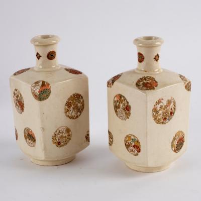 Appraisal: A pair of Japanese Satsuma square section bottle vases painted