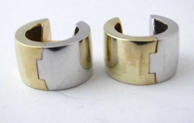 Appraisal: Pair of K white and yellow gold reversible hinged huggie