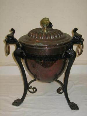 Appraisal: A COPPER AND CAST IRON COAL BUCKET of circular tapering