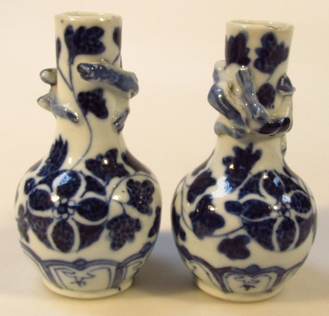 Appraisal: A pair of miniature Japanese porcelain vases decorated with blue