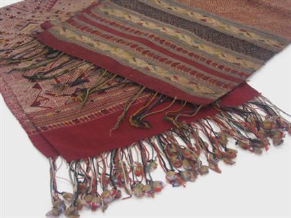 Appraisal: Two red ground fabric textiles th century Both of long