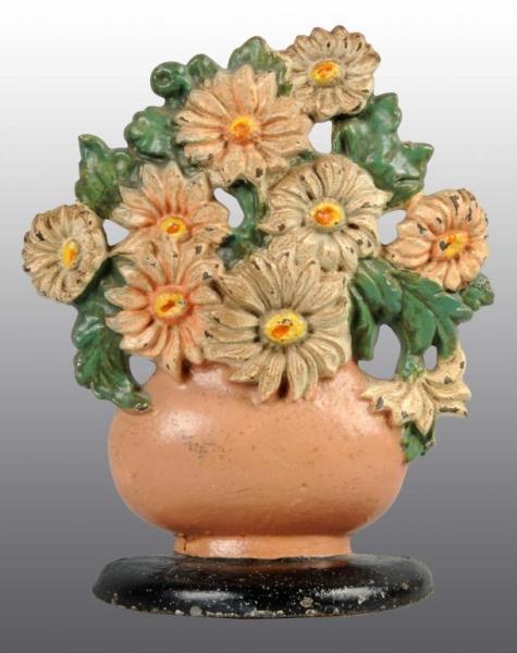 Appraisal: Cast Iron Daisy Bowl Doorstop Description Made by Hubley cat