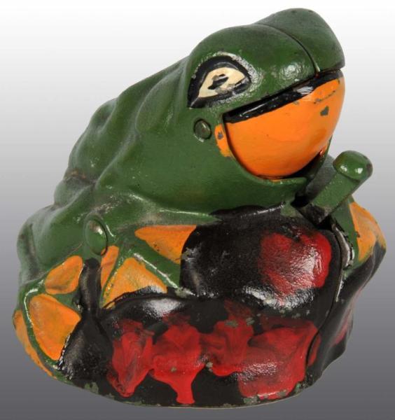 Appraisal: Cast Iron Frog on Rock Mechanical Bank Description Manufactured by