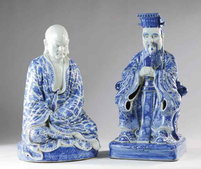 Appraisal: TWO CHINESE BLUE AND WHITE PORCELAIN SEATED FIGURES the first