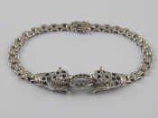 Appraisal: A white metal tests carat gold sapphire panther bracelet in