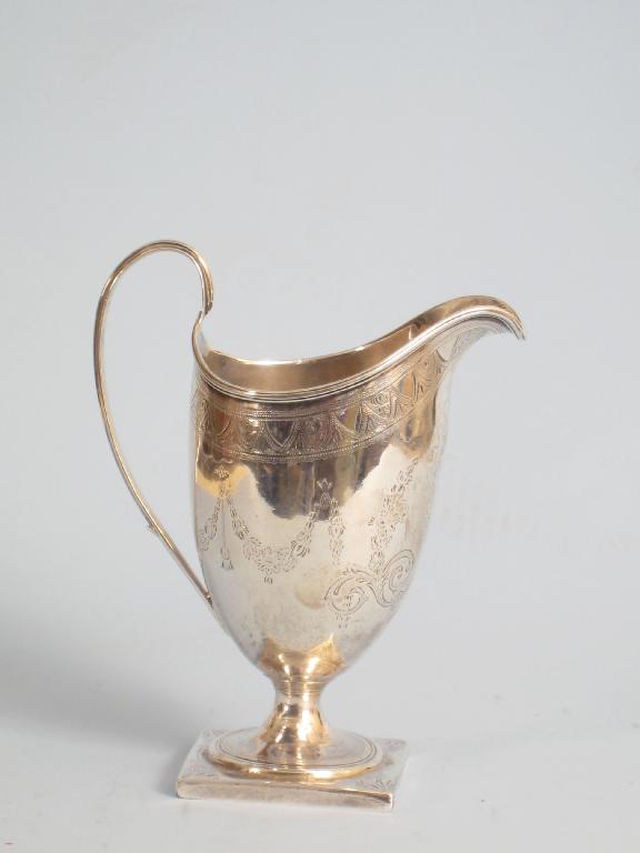 Appraisal: A George III helmet shape Cream Jug with swag engraved