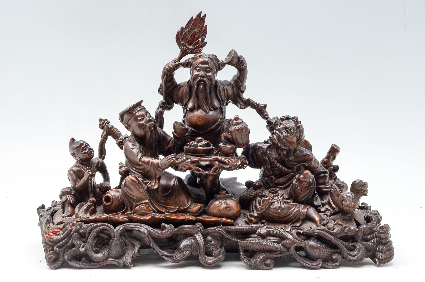 Appraisal: CARVED WOOD CHINESE IMMORTAL GROUPING Craved Chinese immortals having tea