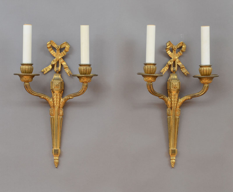 Appraisal: SET OF FOUR LOUIS XVI STYLE GILT-BRONZE TWO-LIGHT WALL SCONCES