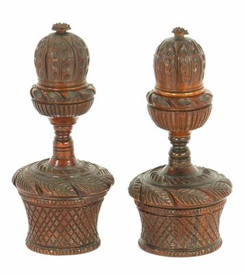 Appraisal: Two matching th century carved and turned coquilla nut and