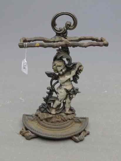 Appraisal: Cast iron umbrella rack with cherub decoration '' Ht