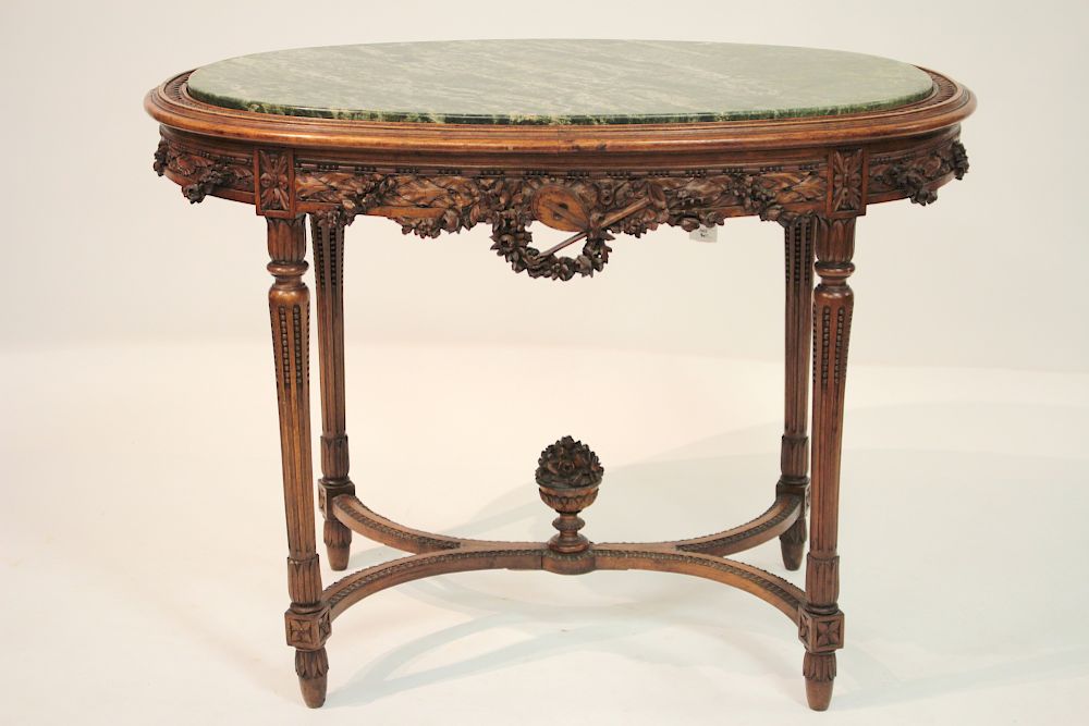 Appraisal: French Provincial Marbletop Well Carved Table th Louis XV-style with