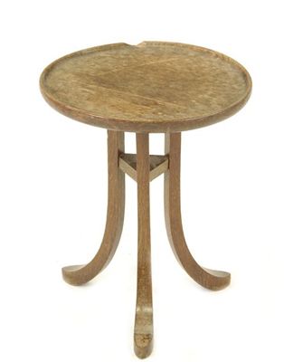 Appraisal: A Liberty Co oak Thebes table circular top on flaring