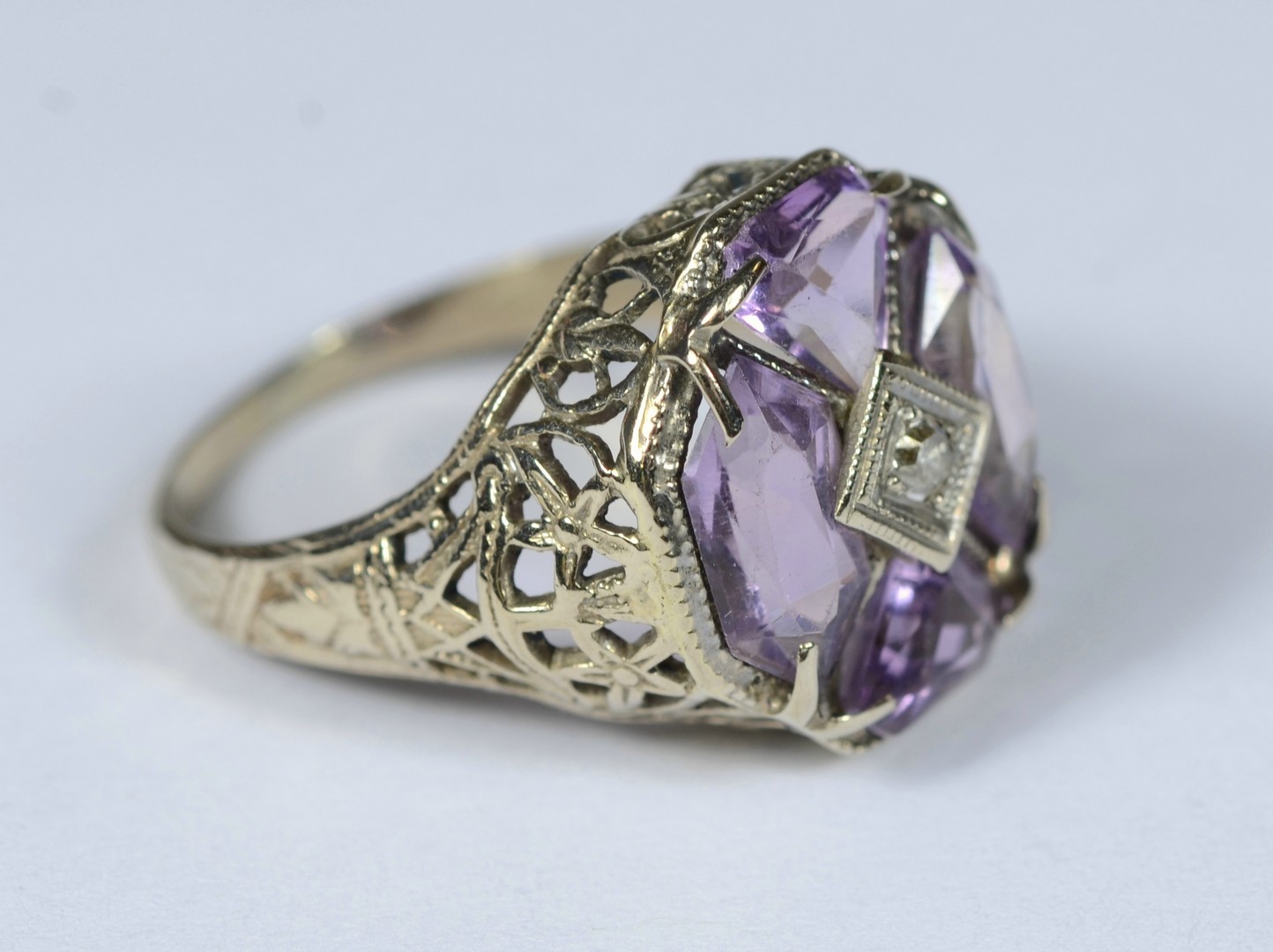 Appraisal: K WG filigree ring with small diamond and amethysts size