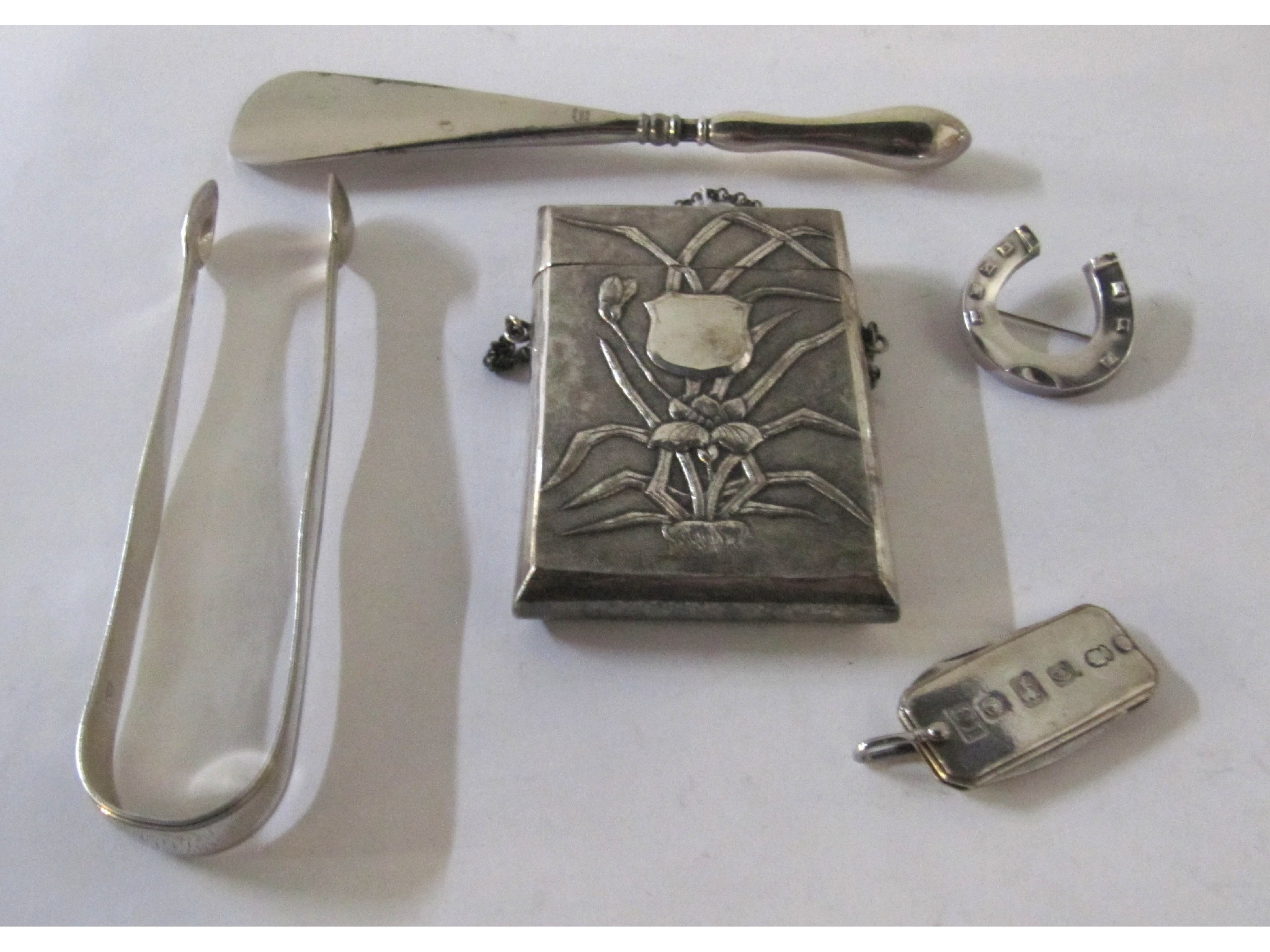 Appraisal: A lot comprising a white metal card case silver knife