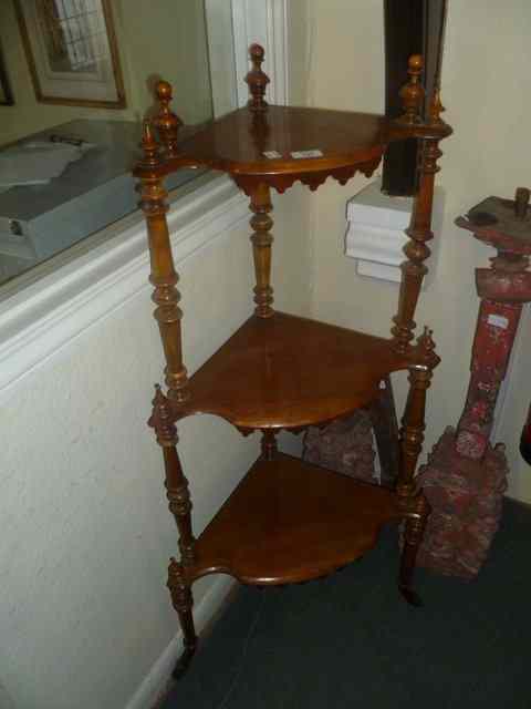 Appraisal: A VICTORIAN WALNUT THREE TIER CORNER WHATNOT with turned spindles