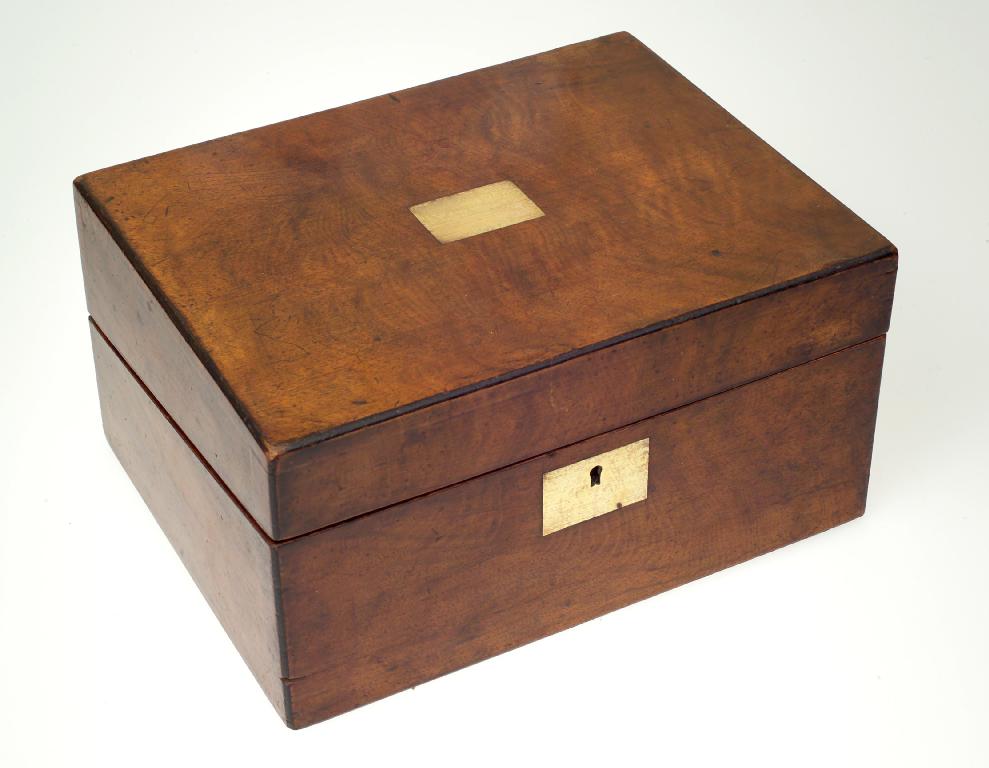 Appraisal: VICTORIAN WALNUT WRITING BOX of rectangular form with leather-lined slope