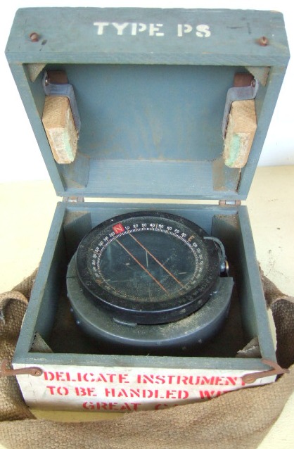 Appraisal: A World War Two military gimbal compass encased in a