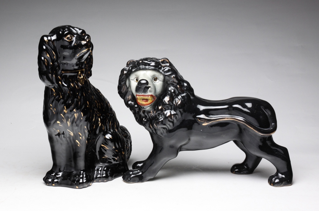 Appraisal: Late th-early th century Standing Staffordshire black lion with glass