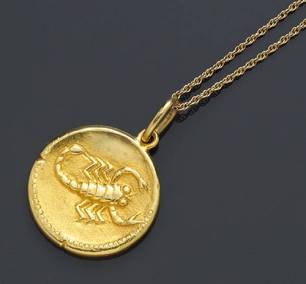 Appraisal: An eighteen karat gold Zodiac pendant and chain Van Cleef