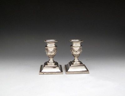 Appraisal: A pair of late-Victorian silver dwarf candlesticks by Rupert Favell