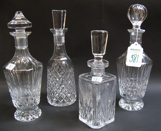 Appraisal: FOUR CLEAR CUT CRYSTAL LIQUOR DECANTERS in a variety of