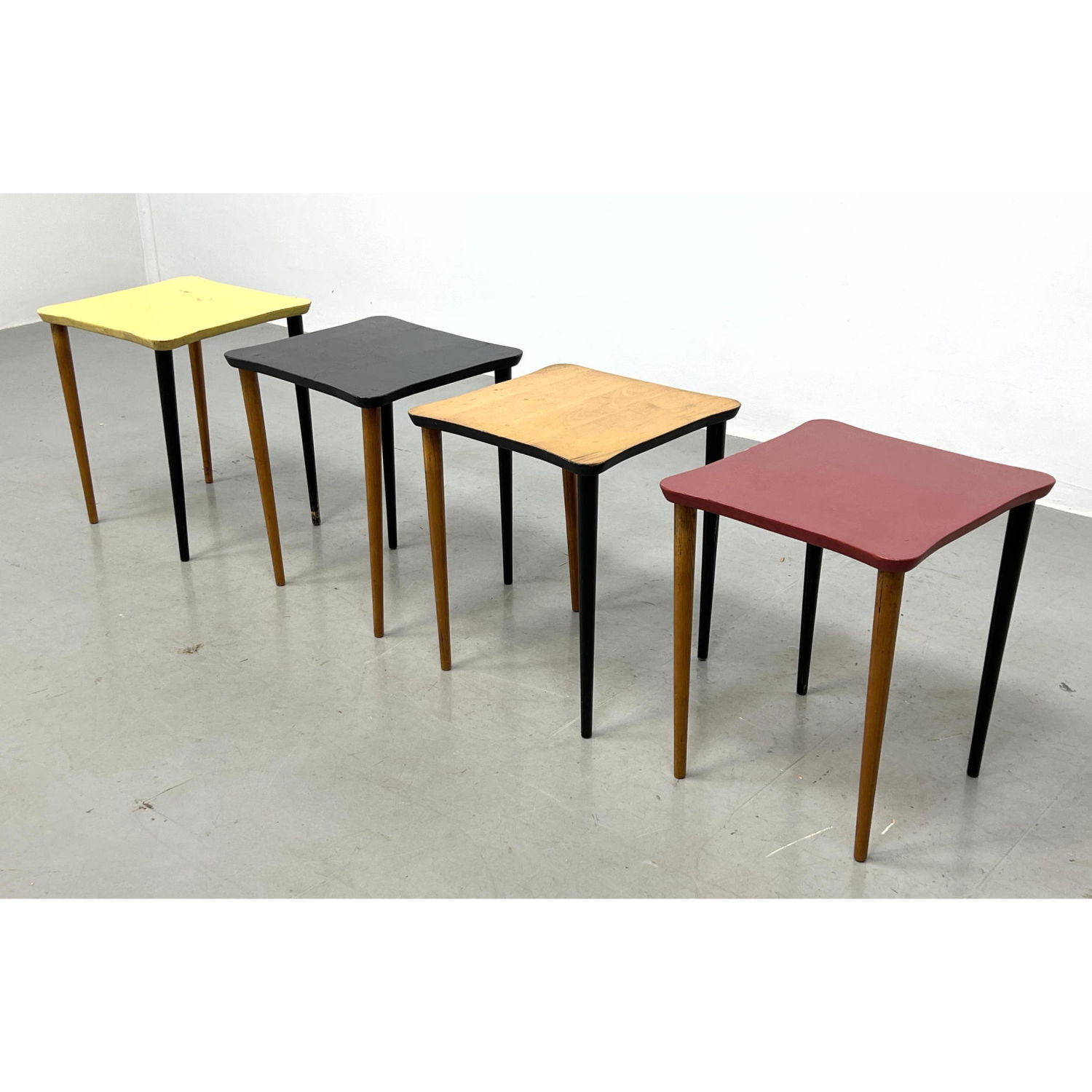 Appraisal: pc Nesting Side Tables Natural Wood Red Yellow and Black