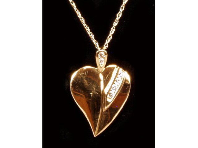 Appraisal: Superb ladies karat yellow gold heart design pendant channel set