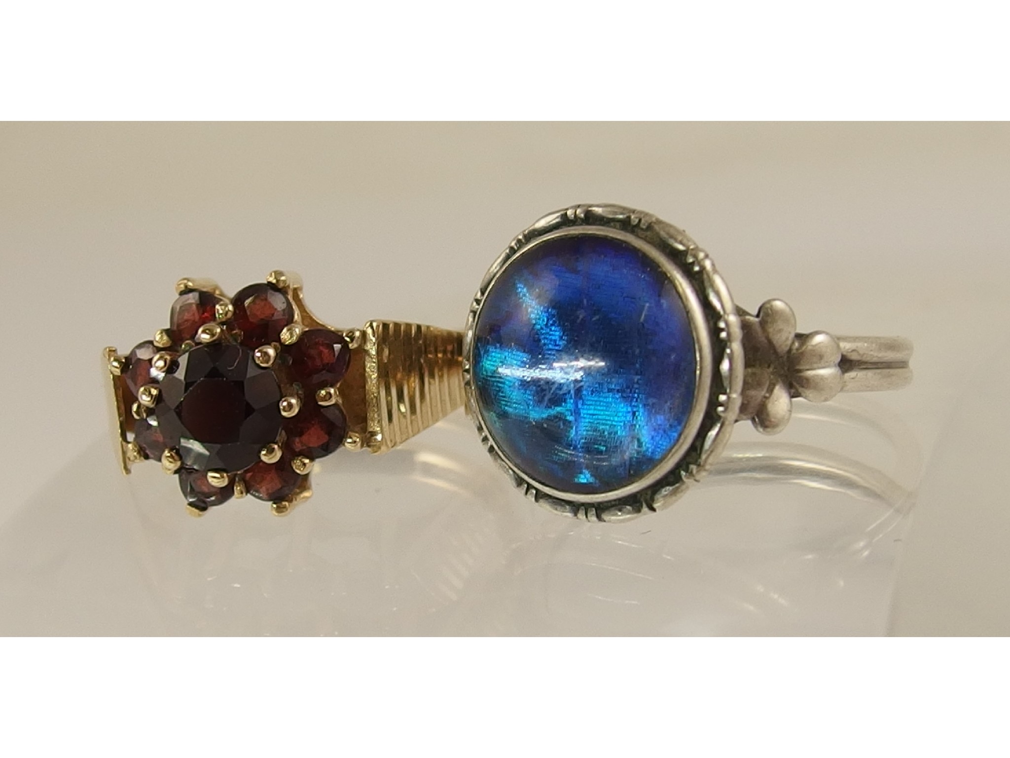 Appraisal: A ct garnet set ring and a silver Arts and