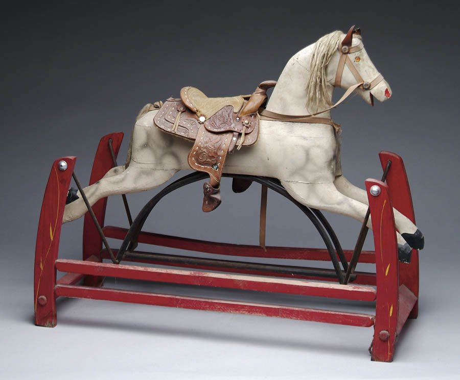 Appraisal: CHILD S ROCKING HORSE ON STAND The red painted stand