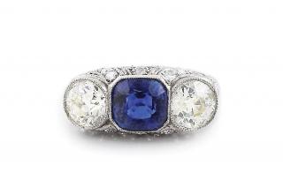 Appraisal: An Edwardian Three Stone Sapphire and Diamond Ring A wide