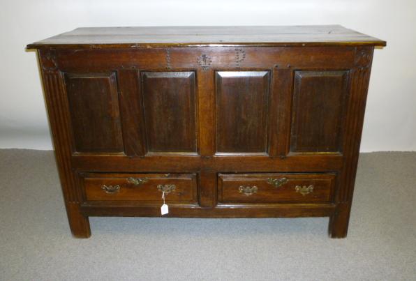 Appraisal: AN OAK MULE CHEST th century with hinged plank lid